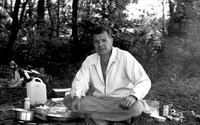 Terrence Jackson beside mess kit, camping at Deep Creek Lake, Maryland (Summer, 1963)