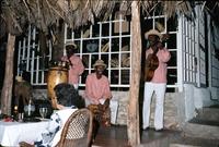 Three piece band performing for restaurant patrons