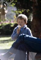 Young boy eating ice cream cone