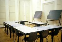 View of a small empty classroom with two portable blackboards