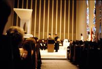 Dean Herbert Striner stands to the right of the podium during the 1981 commencement ceremony at American University, Washington, D.C.