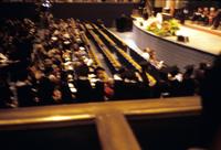 Blurry balcony view of the audience at a commencement ceremony at American University, Washington, D.C.