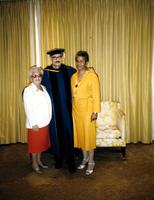 Dean Herbert Striner stands in commencement regalia with his mother, Pearl Striner and wife Iona Striner at American University, Washington, D.C.