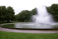 A circular fountain in a park