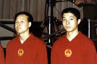 Ch'en Pao-ching and Hu Kwi-hain standing with stage equipment behind them at match in New York City