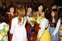 American girls presenting flowers to the female Chinese table tennis team players after match in New York City