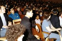 Children and Chinese delegation members sitting in auditorium in P.S. 75 in New York City