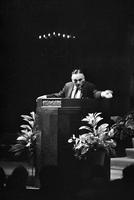 Alternate view of a man gripping a lectern during a service in the Washington Hebrew Congregation, Washington, D.C.