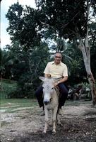Herb Striner sitting on a burro