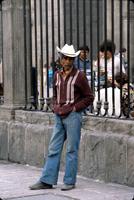 Unidentified man standing in front of a gate, Mexico City, Mexico