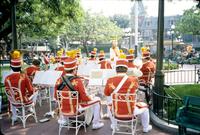 A band sits and warms up in Disneyland, Anaheim, California