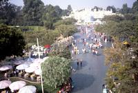 Wide high angle view of visitors walking through Disneyland, Anaheim, California